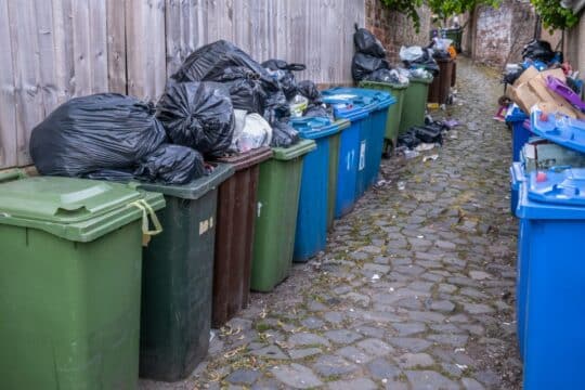 Overflowing Rubbish In A Back Alley