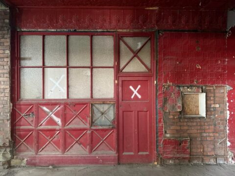 Uncovered pressed steel tiles and stairs from original cinema entrance at The Exchange Blackburn