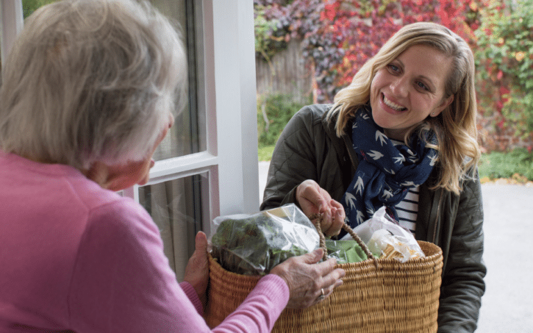 A carer carrying shopping