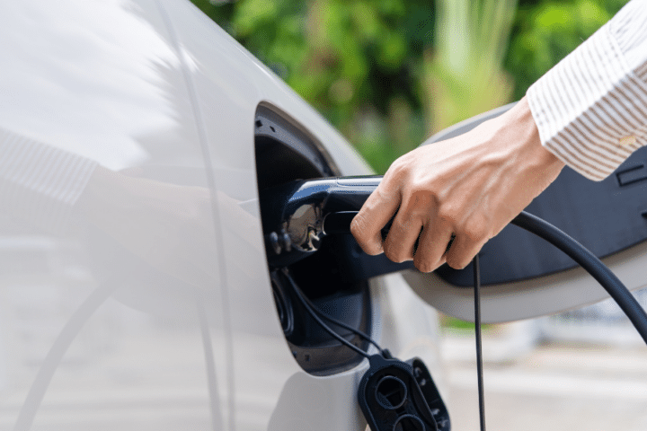 Car charger being plugged into car.