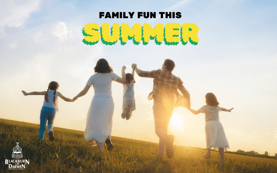 A family of five runs hand in hand across a grassy hill at sunset, with summer fun text and the Blackburn with Darwen Borough Council logo.